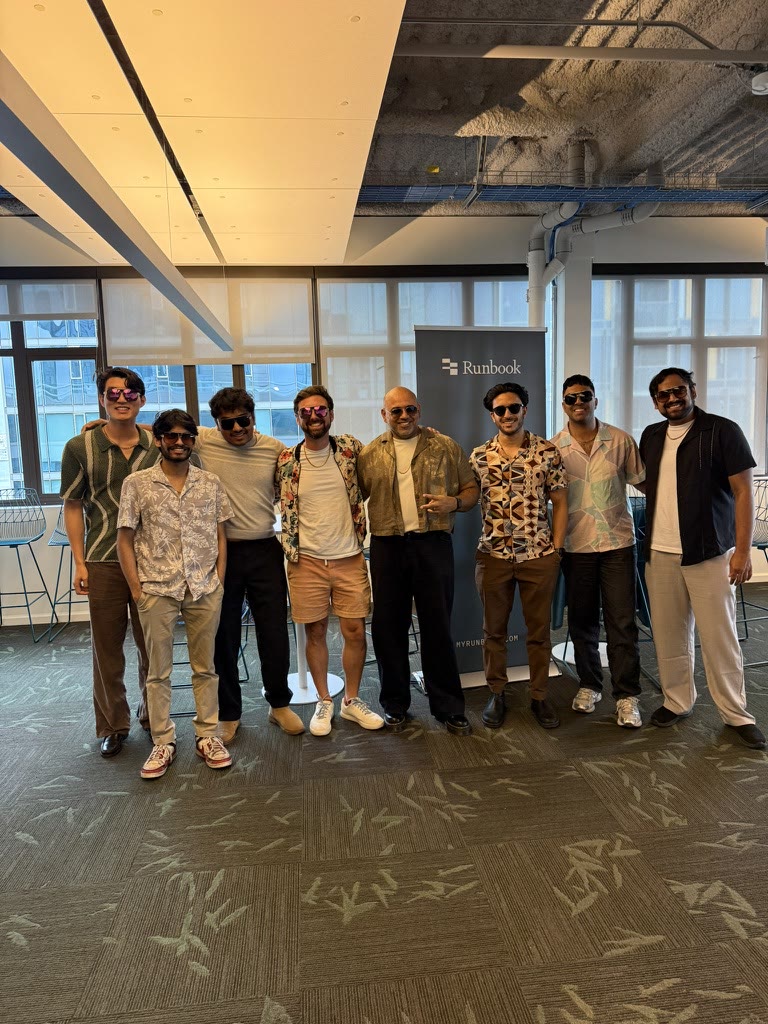 The Runbook team dressed in sunglasses and patterned shirts